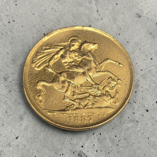 1887 Double Sovereign coin by Reeves and Sons, showing detailed side and classic design with intricate engravings.