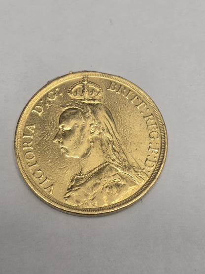 1887 Double Sovereign coin from Reeves and Sons, showing detailed side with intricate design and historical coin features.