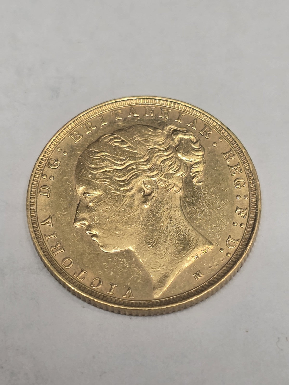 1887 Reeves and Sons Full Sovereign coin, 8g gold coin with detailed historical design, showcasing the classic sovereign style.