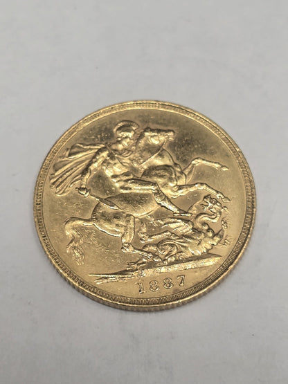 1887 Reeves and Sons full sovereign coin, 8g gold coin with detailed historic design and engraved inscriptions.