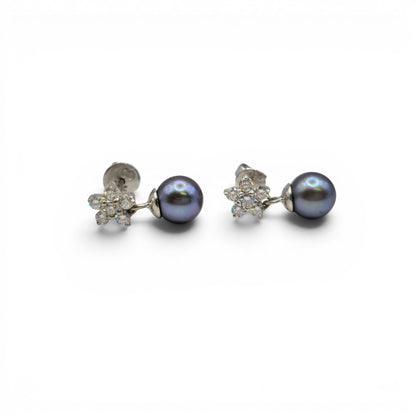 18ct white gold diamond and pearl earrings by Reeves and Sons, featuring elegant pearl drops and sparkling diamonds.