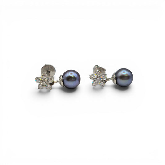 18ct white gold diamond and pearl earrings by Reeves and Sons, featuring elegant pearl drops and sparkling diamonds.