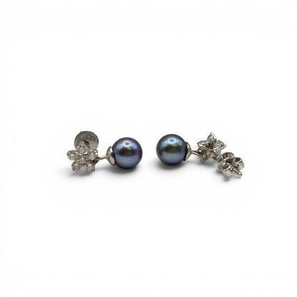18ct white gold diamond and pearl earrings by Reeves and Sons, featuring elegant pearls and sparkling diamonds.