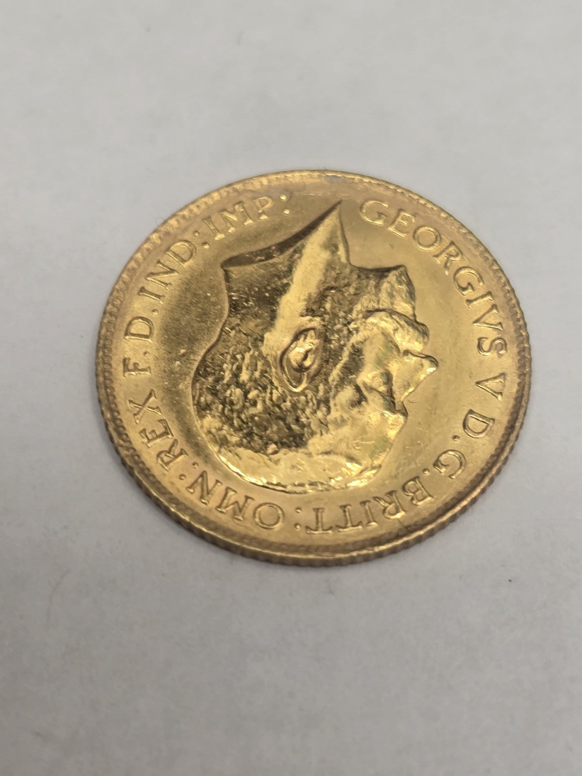 1914 Half Sovereign Coin by Reeves and Sons, 4g gold coin featuring historic design and detailed obverse and reverse images.