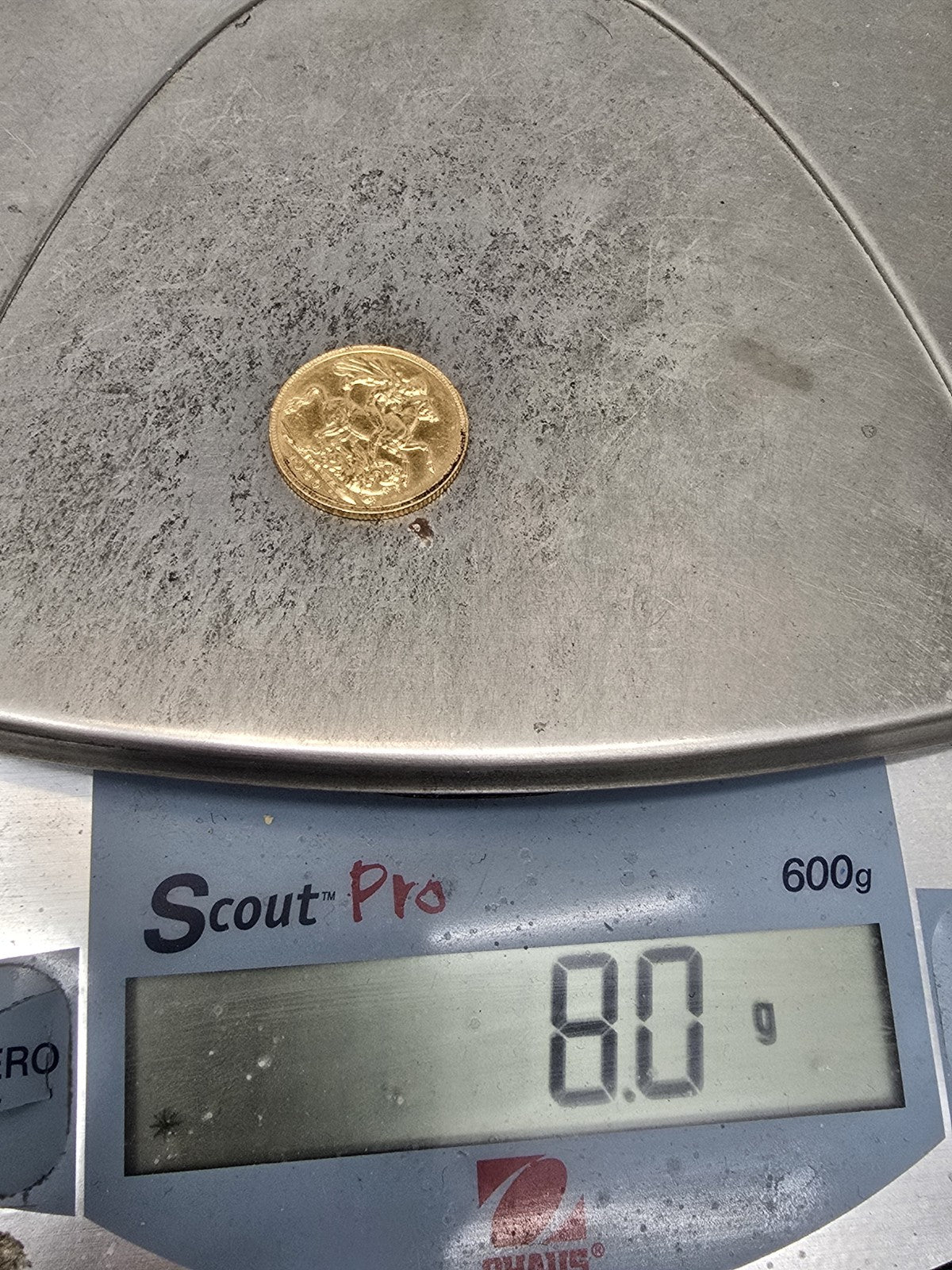 1920 Reeves and Sons full sovereign coin, 8g gold coin with detailed design and historical British currency features