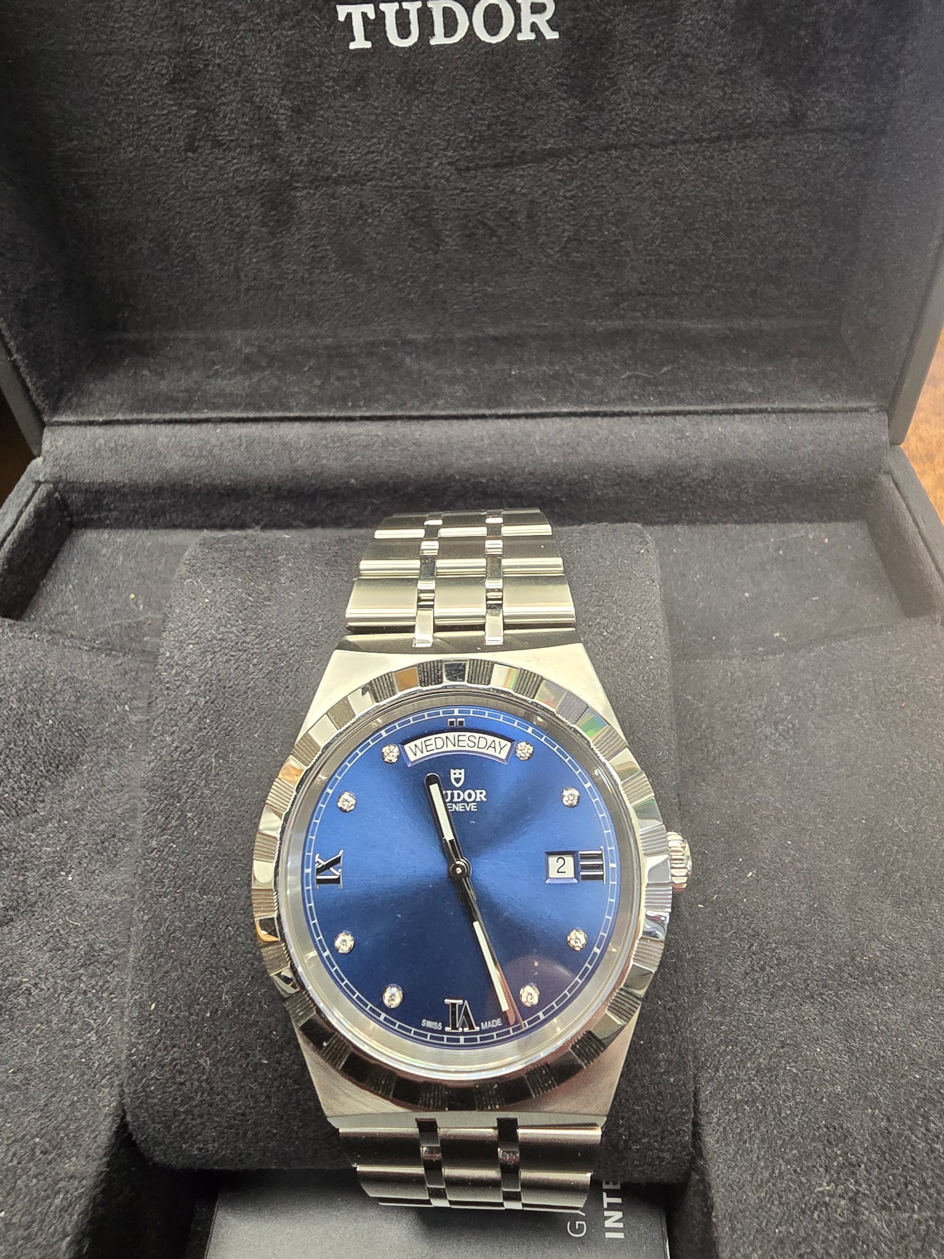 Reeves and Sons Tutor Royal Day Date Diamond Watch model 28600, with gold case, white dial, and diamond accents, 2021.