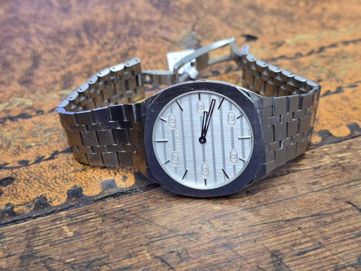Reeves and Sons ladies Gucci watch box with accompanying papers, elegant black presentation case for women's luxury watch.