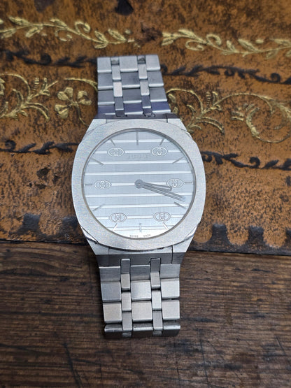 Reeves and Sons ladies Gucci watch box with paper, featuring a sleek black design and elegant branding for jewelry storage.