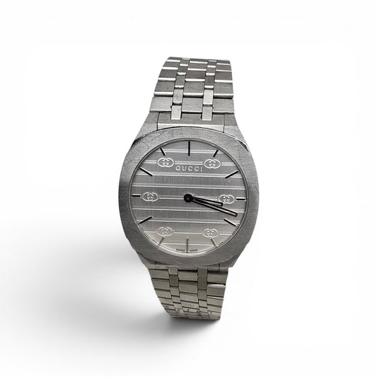 Reeves and Sons ladies Gucci watch box with accompanying paper, elegant packaging for a luxury wristwatch.