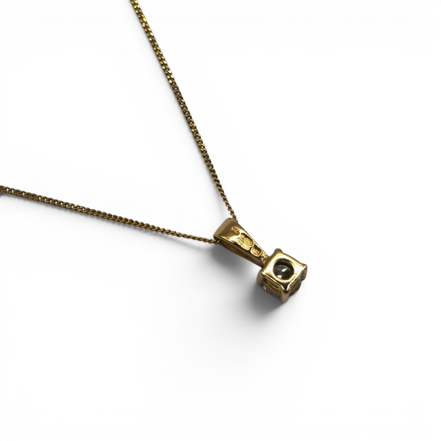 Reeves and Sons 9ct yellow gold diamond pendant with 0.25 carat diamond on matching 9ct gold chain.