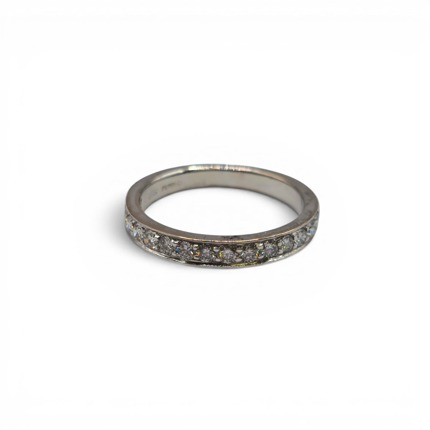 18ct white gold half eternity diamond ring by Reeves and Sons featuring sparkling diamonds in a sleek band design.