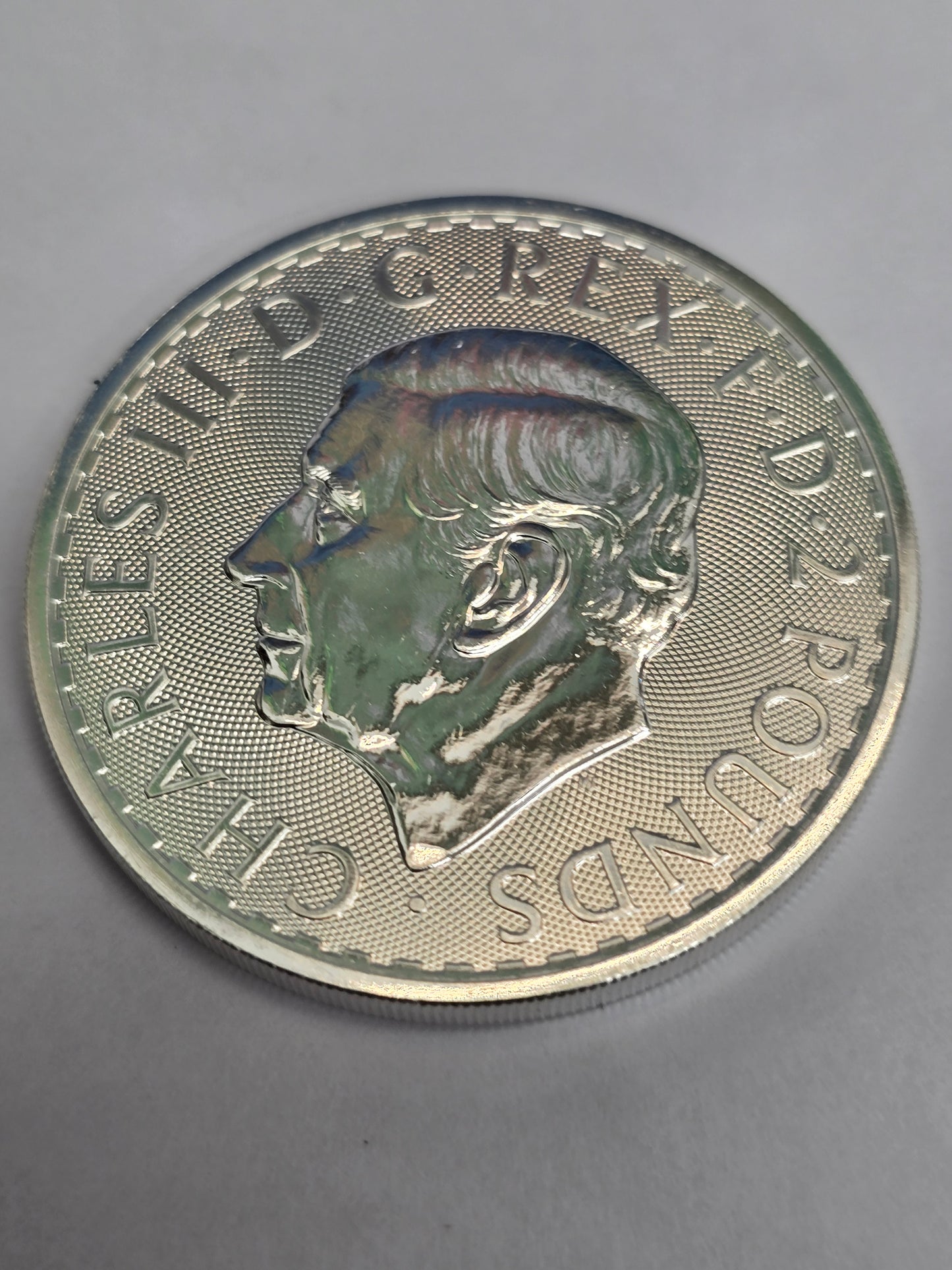 Silver 1oz 2025 Britannia coin by Reeves and Sons, featuring detailed Britannia design on fine silver £2 coin.