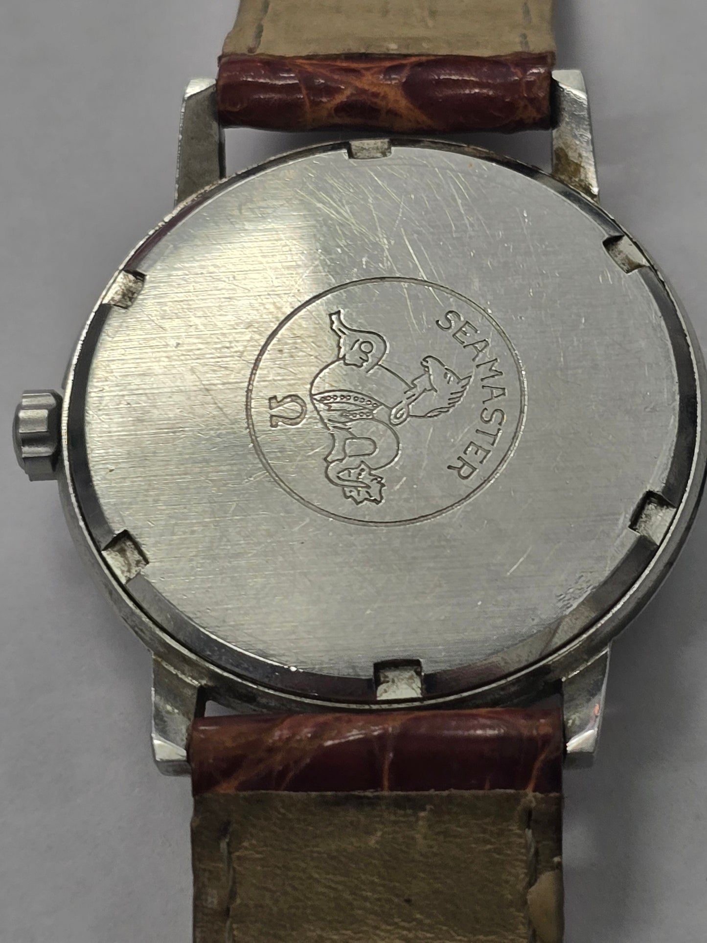Vintage Omega Seamaster 600 Swiss watch with brown leather strap, showcasing the classic dial and case details.