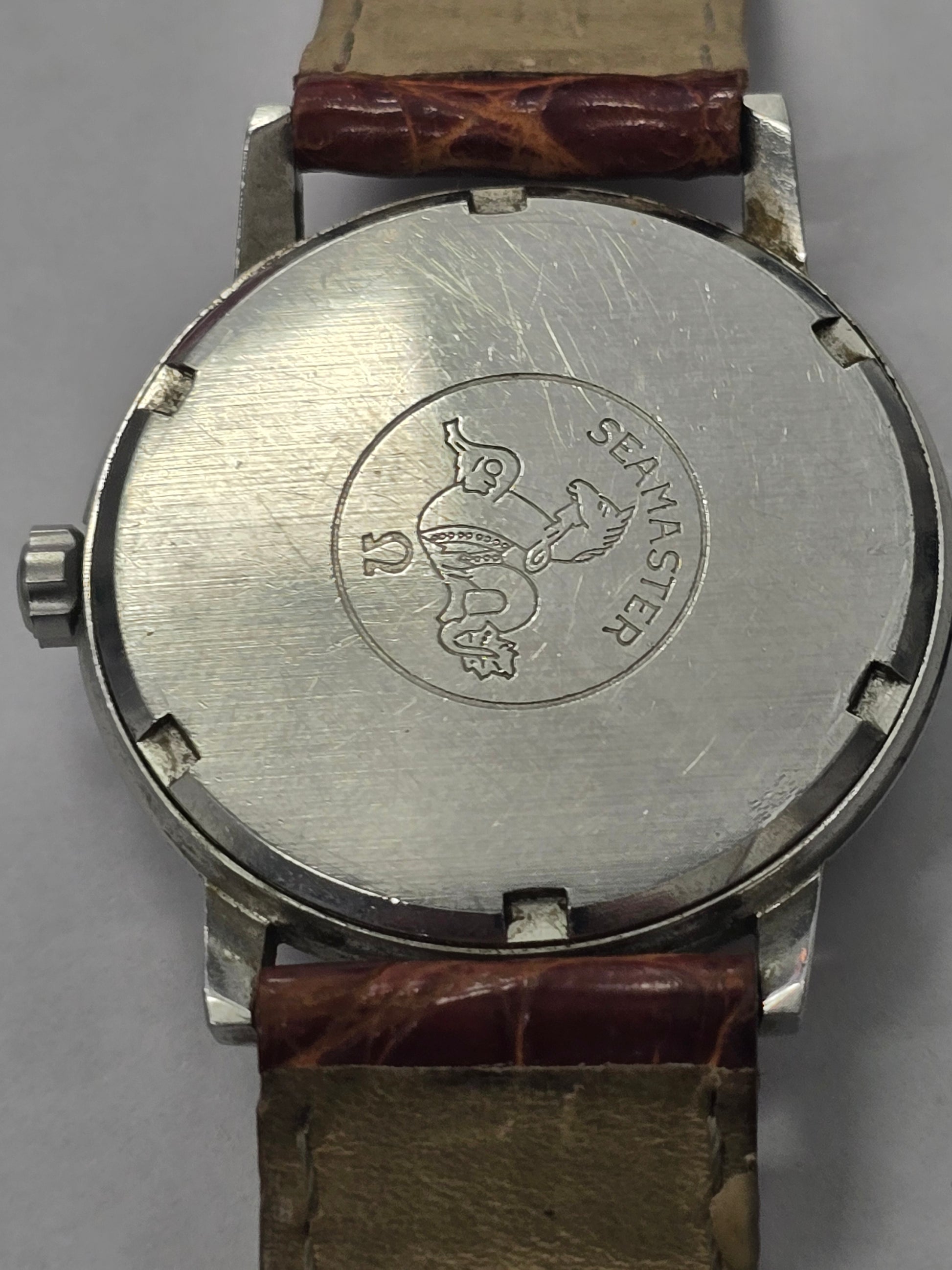Vintage Omega Seamaster 600 Swiss watch with brown leather strap, showcasing the classic dial and case details.