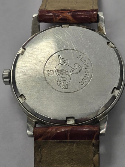 Vintage Omega Seamaster 600 Swiss watch with brown leather strap, showcasing the classic dial and case details.