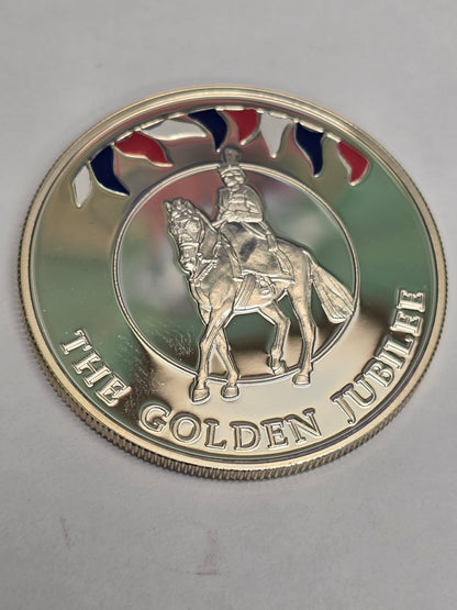 Silver 50 pence Golden Jubilee coin from 2002 by Reeves and Sons, showing detailed Jubilee design on the coin's surface.