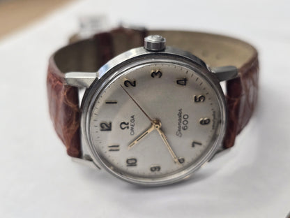 Vintage Omega Seamaster 600 Swiss-made watch with brown leather strap, classic design and metallic case.