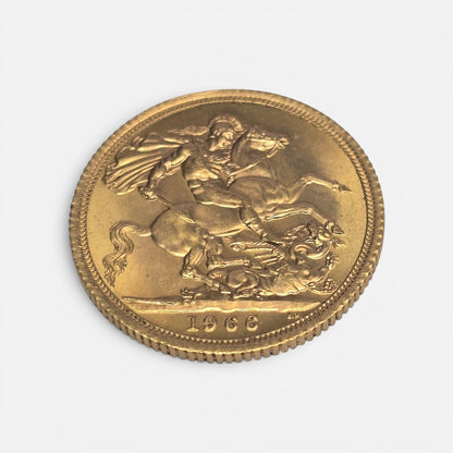 1966 Reeves and Sons gold sovereign coin in good condition, close-up showing detailed design and historical features.