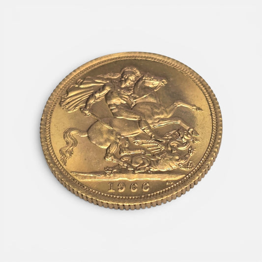 1966 Reeves and Sons gold sovereign coin in good condition, close-up showing detailed design and historical features.