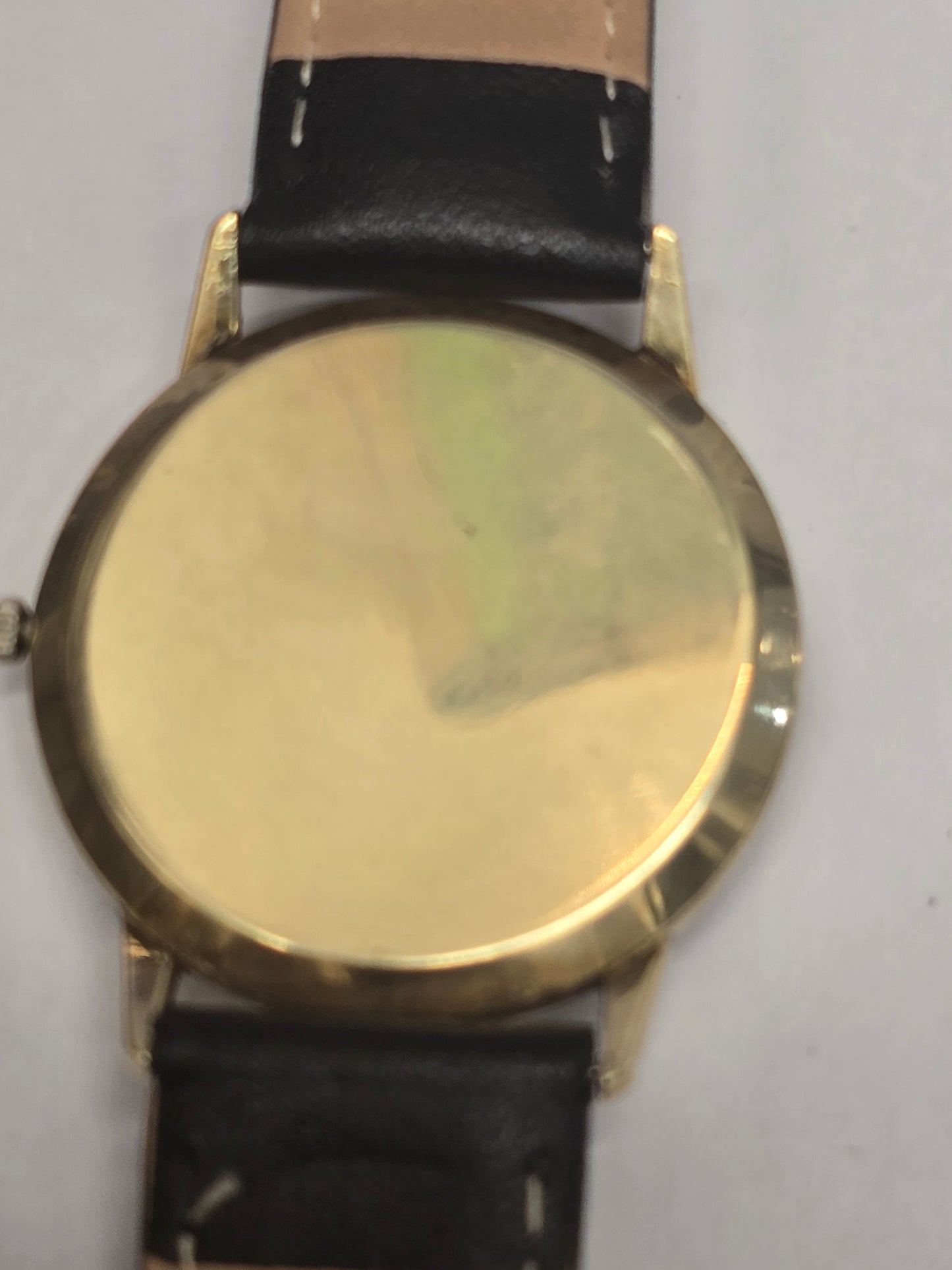9ct yellow gold vintage Buren Intra-Matic automatic men's Swiss watch with classic design and gold-tone bracelet.
