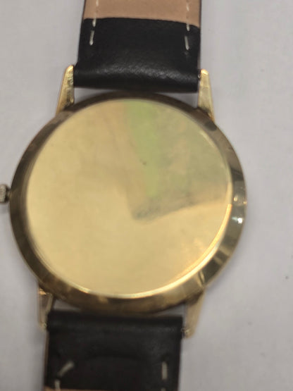 9ct yellow gold vintage Buren Intra-Matic automatic men's Swiss watch with classic design and gold-tone bracelet.