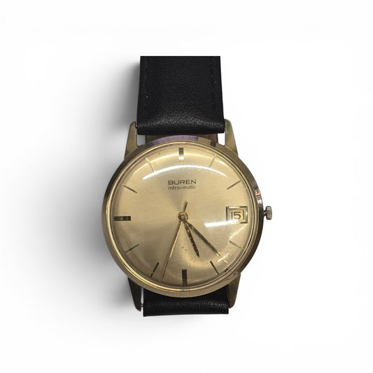 Vintage 9ct yellow gold Buren Intra-Matic automatic men's Swiss watch by Reeves and Sons, showcasing a classic timepiece with a gold case.