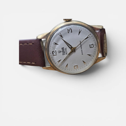 9ct yellow gold Tudor Royal watch with a brown leather strap, featuring a classic round dial and elegant design.