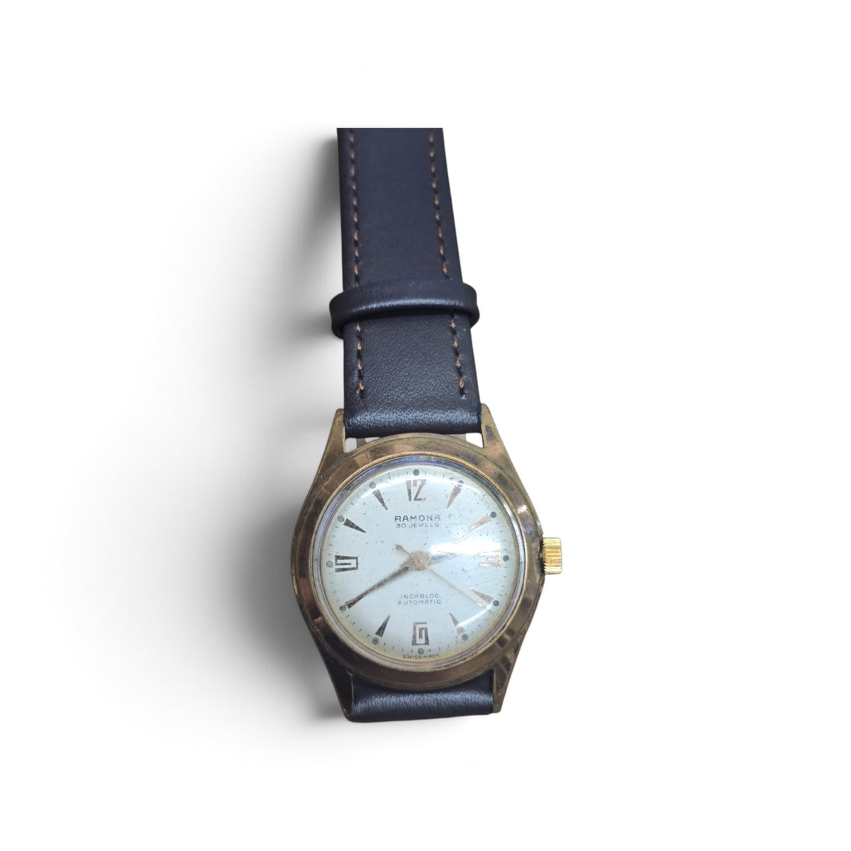 Vintage Ramona 30 Jewels Incabloc automatic Swiss watch by Reeves and Sons, showcasing the classic dial and stainless steel case.