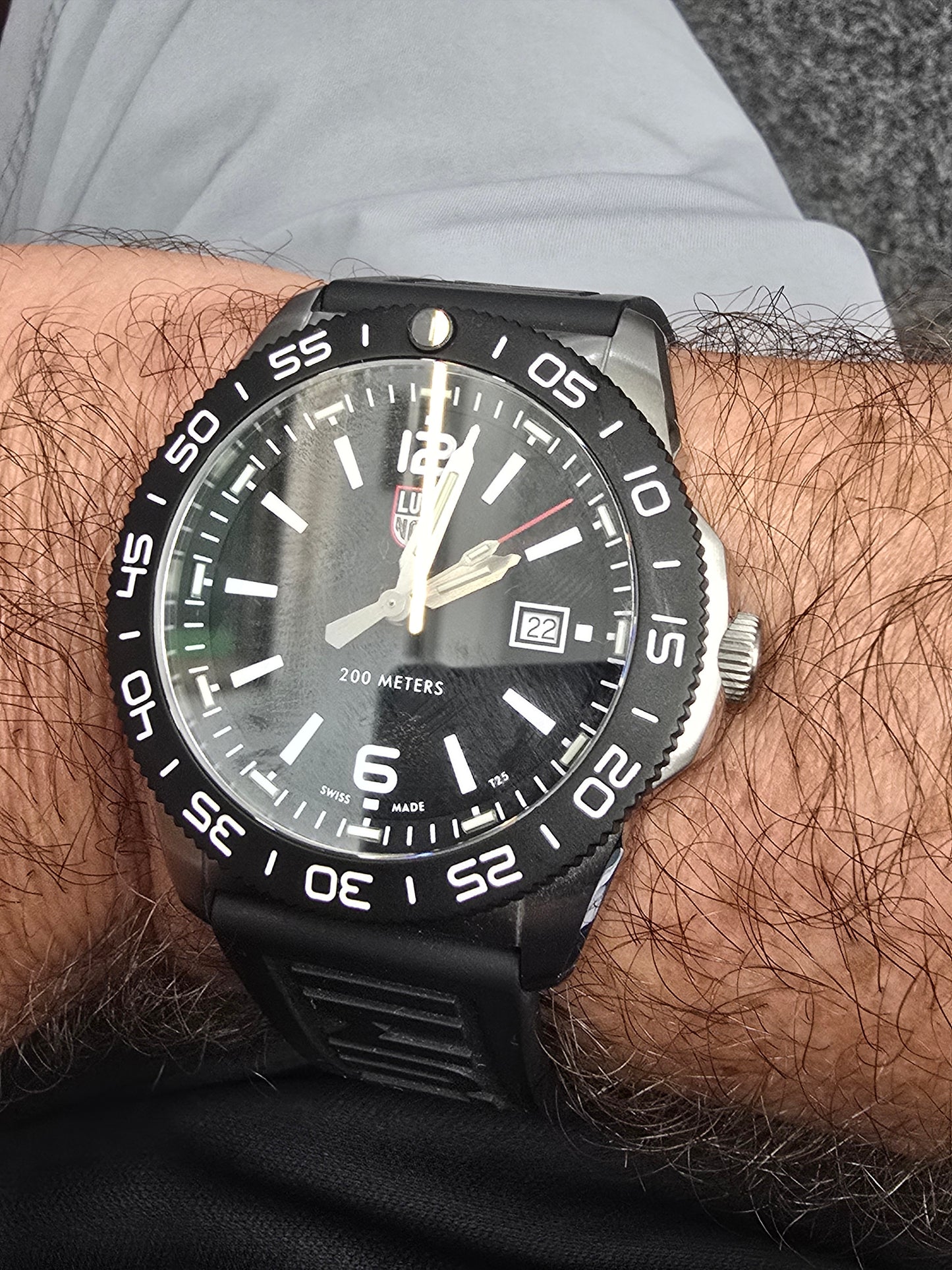 Reeves and Sons Navy SEAL style dive watch with black dial, rotating bezel, rubber strap, 200M water resistance.