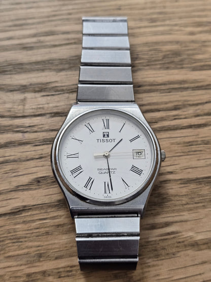 Vintage Tissot Seastar Quartz Stainless Steel White Dial Roman Numeral Date Watch