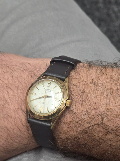 Vintage Reeves and Sons Ramona 30 Jewels Incabloc automatic Swiss watch with a classic dial and stainless steel case.