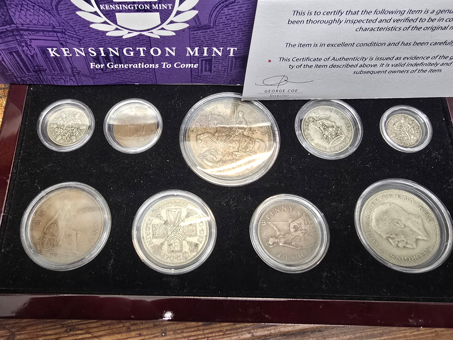 Kensington Mint 1935 Silver Jubilee silver coin set by Reeves and Sons in box with certificate, detailed coin images and packaging.