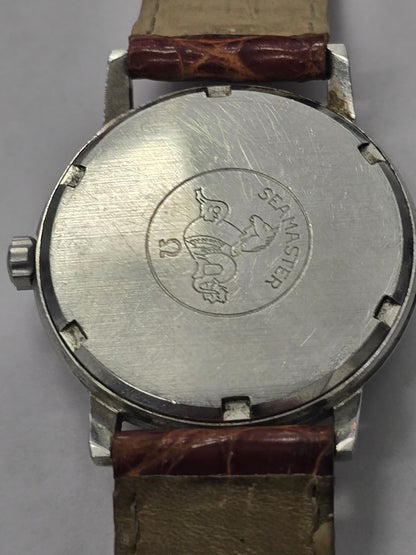 Vintage Omega Seamaster 600 Swiss-made watch with brown leather strap, showcasing the classic dial and stainless steel case.