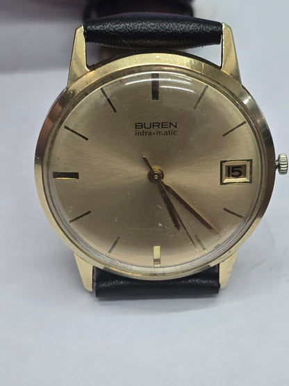 Vintage 9ct yellow gold Buren Intra-Matic automatic men's watch with black dial and gold-tone hands, Swiss Made.