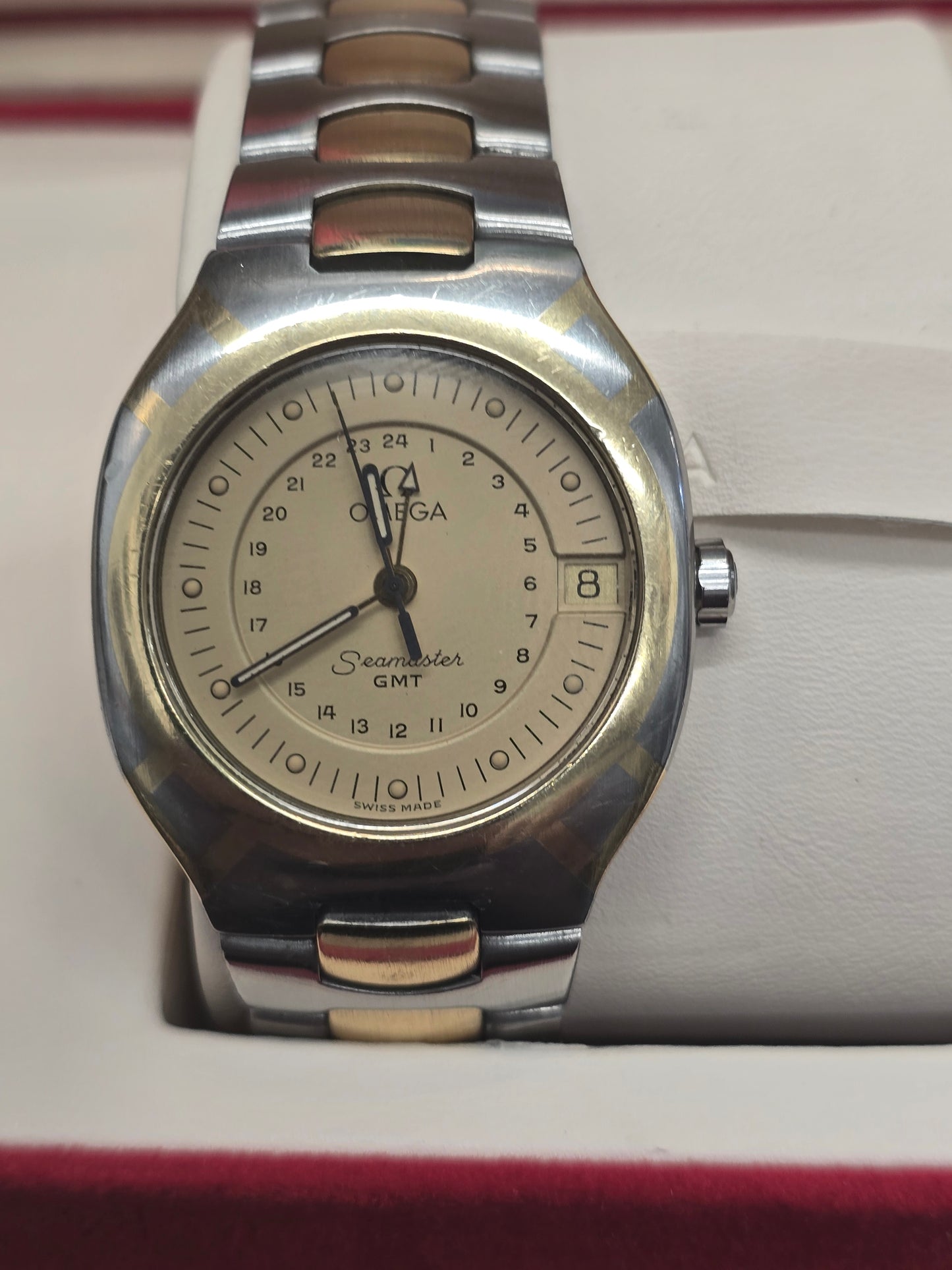 Vintage Omega Seamaster Polaris Chronograph watch from the 1980s with steel and gold details, featuring a black dial and gold accents.