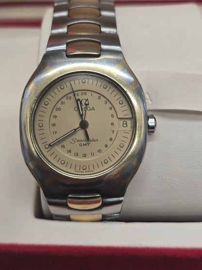 Vintage Omega Seamaster Polaris Chronograph watch from the 1980s with steel and gold details, featuring a black dial and gold accents.