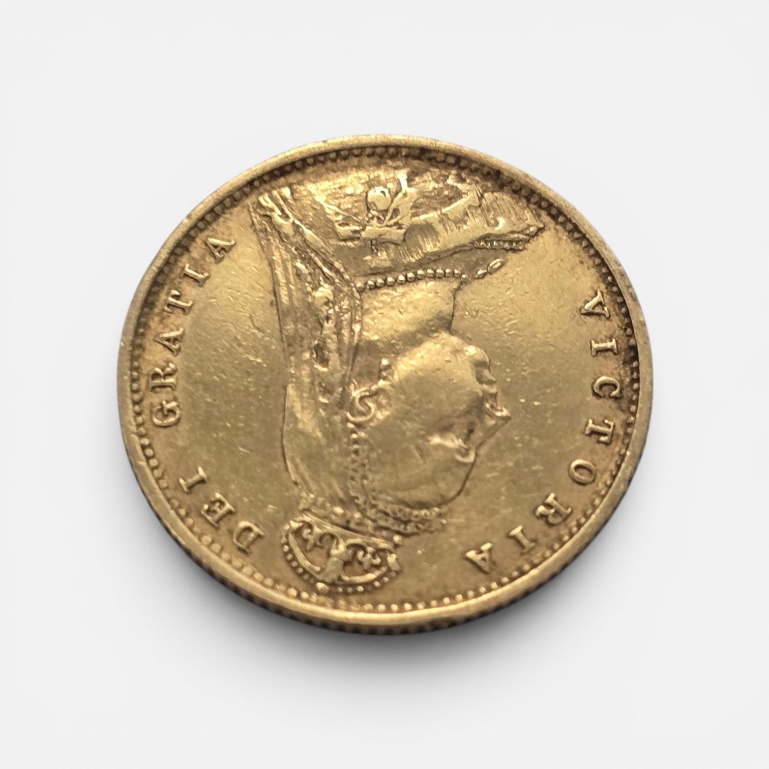 Gold coin featuring Queen Victoria, 1890 Half Sovereign, Reeves and Sons gold coin with detailed portrait and intricate design.