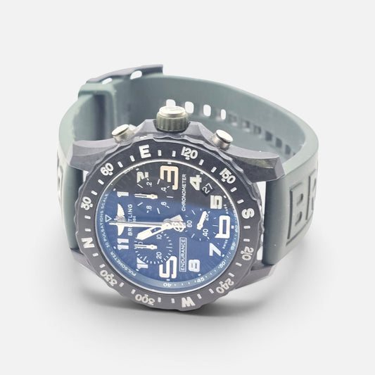 Breitling Endurance Pro 44 watch with khaki green and black dial, stainless steel case, and sporty design.