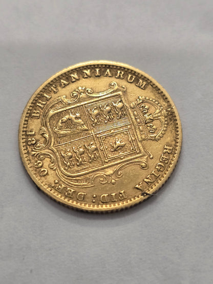 Victorian Queen Victoria 1890 half sovereign gold coin from Reeves and Sons, detailed image showing coin's design and inscriptions.