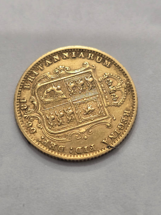 Victorian Queen Victoria 1890 half sovereign gold coin from Reeves and Sons, detailed image showing coin's design and inscriptions.