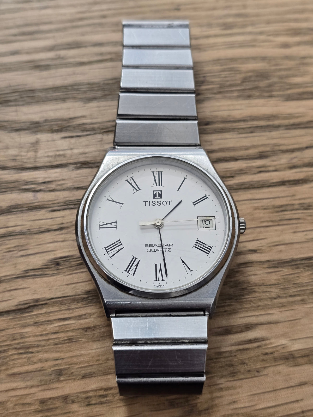 Vintage Tissot Seastar Quartz Stainless Steel White Dial Roman Numeral Date Watch