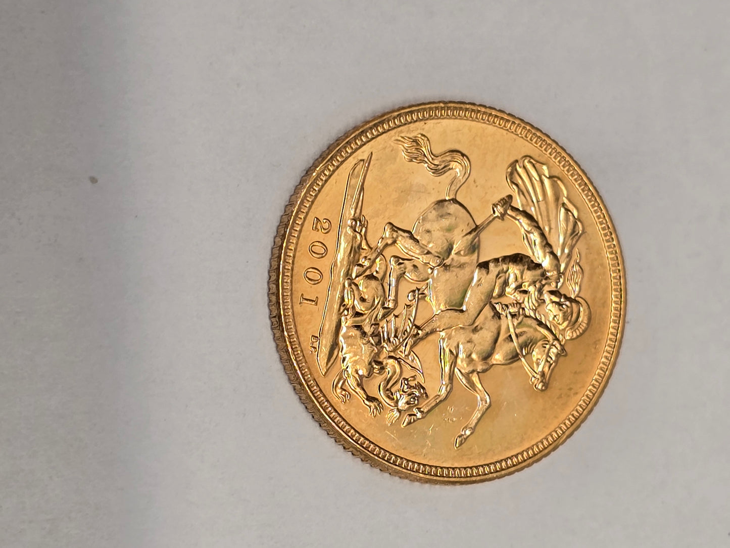 2001 Reeves and Sons full sovereign coin with detailed portrait and intricate engravings, showcasing classic gold coin craftsmanship.