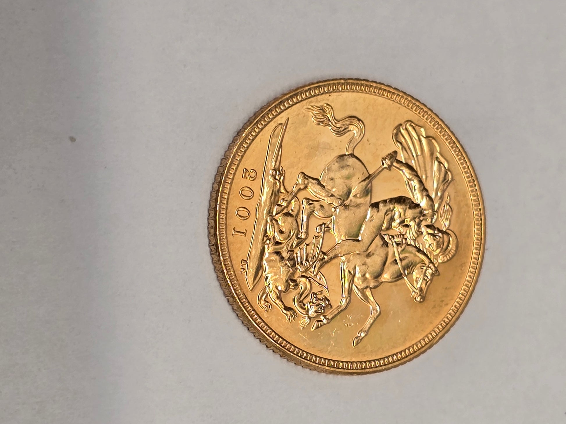 2001 Reeves and Sons full sovereign coin with detailed portrait and intricate engravings, showcasing classic gold coin craftsmanship.