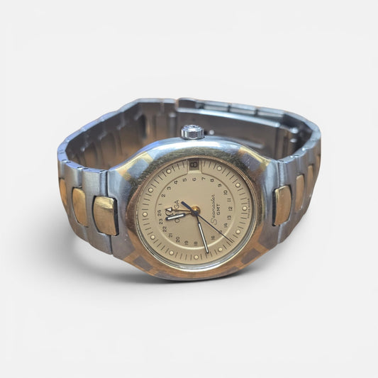 Vintage Omega Seamaster Polaris Chronograph watch with gold and steel bracelet, black dial, and multiple chronograph subdials.