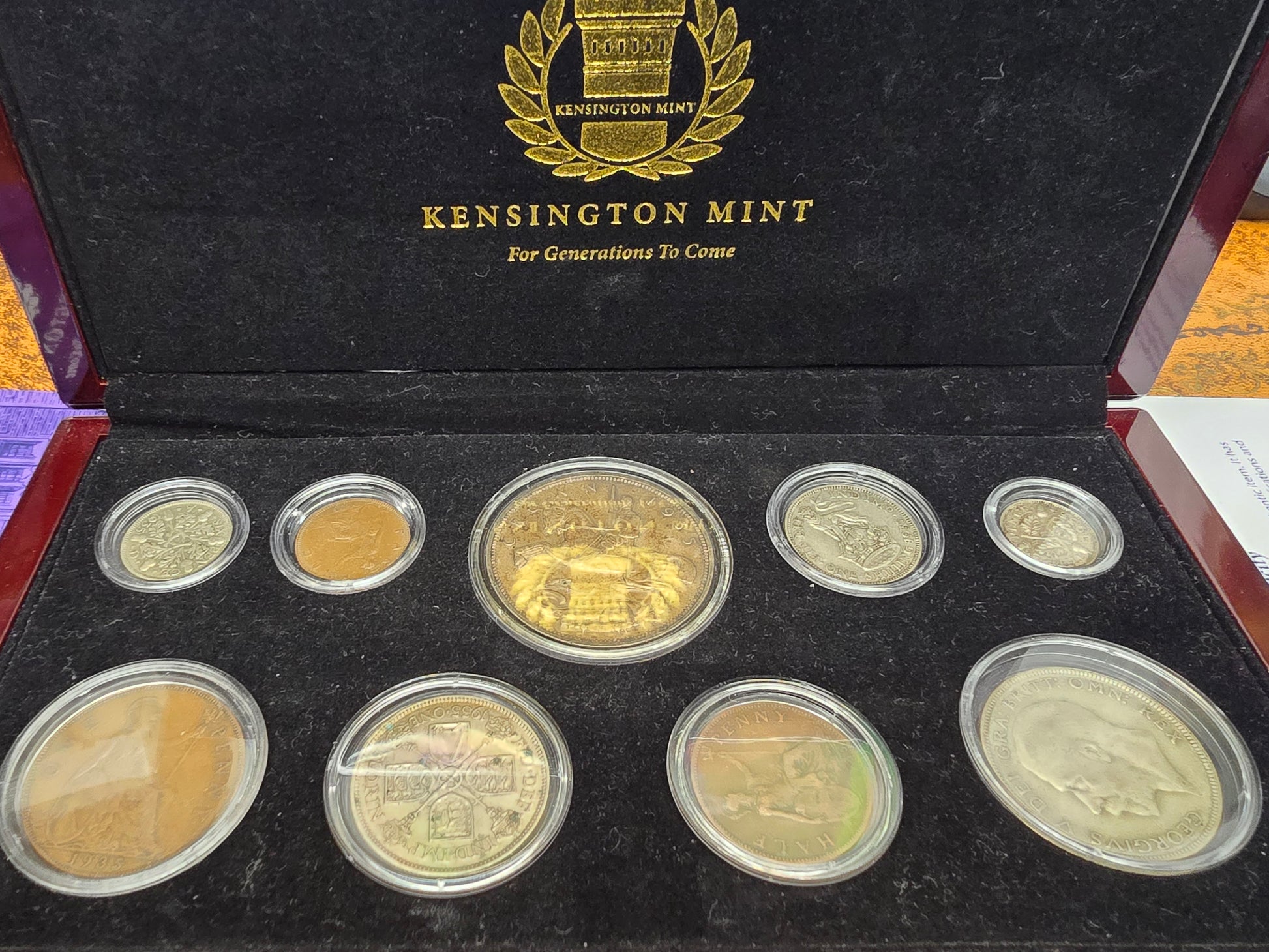 Reeves and Sons Kensington Mint 1935 Silver Jubilee silver coin set with box and certificate, displayed on a white background.