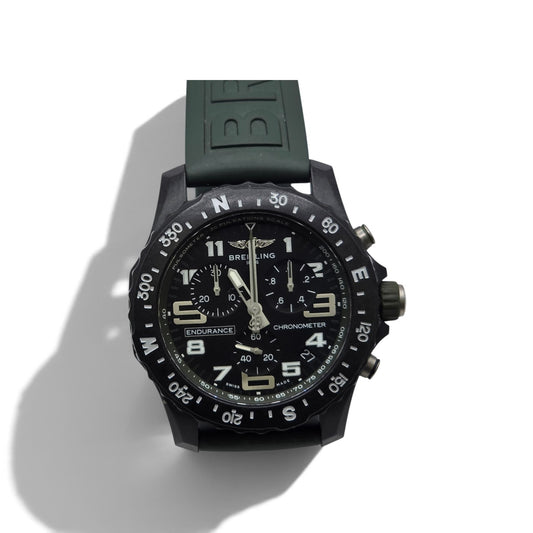 Breitling Endurance Pro 44 watch in khaki green and black with digital and analog display, stainless steel case.