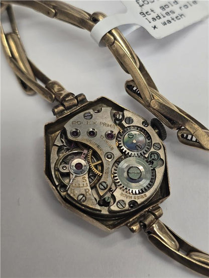 9ct yellow gold ladies Rolex watch with classic design, featuring a round dial and elegant bracelet, style SH26511B.