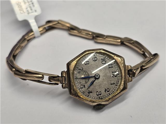 9ct yellow gold ladies Rolex watch with a classic design, featuring a round dial and elegant bracelet.