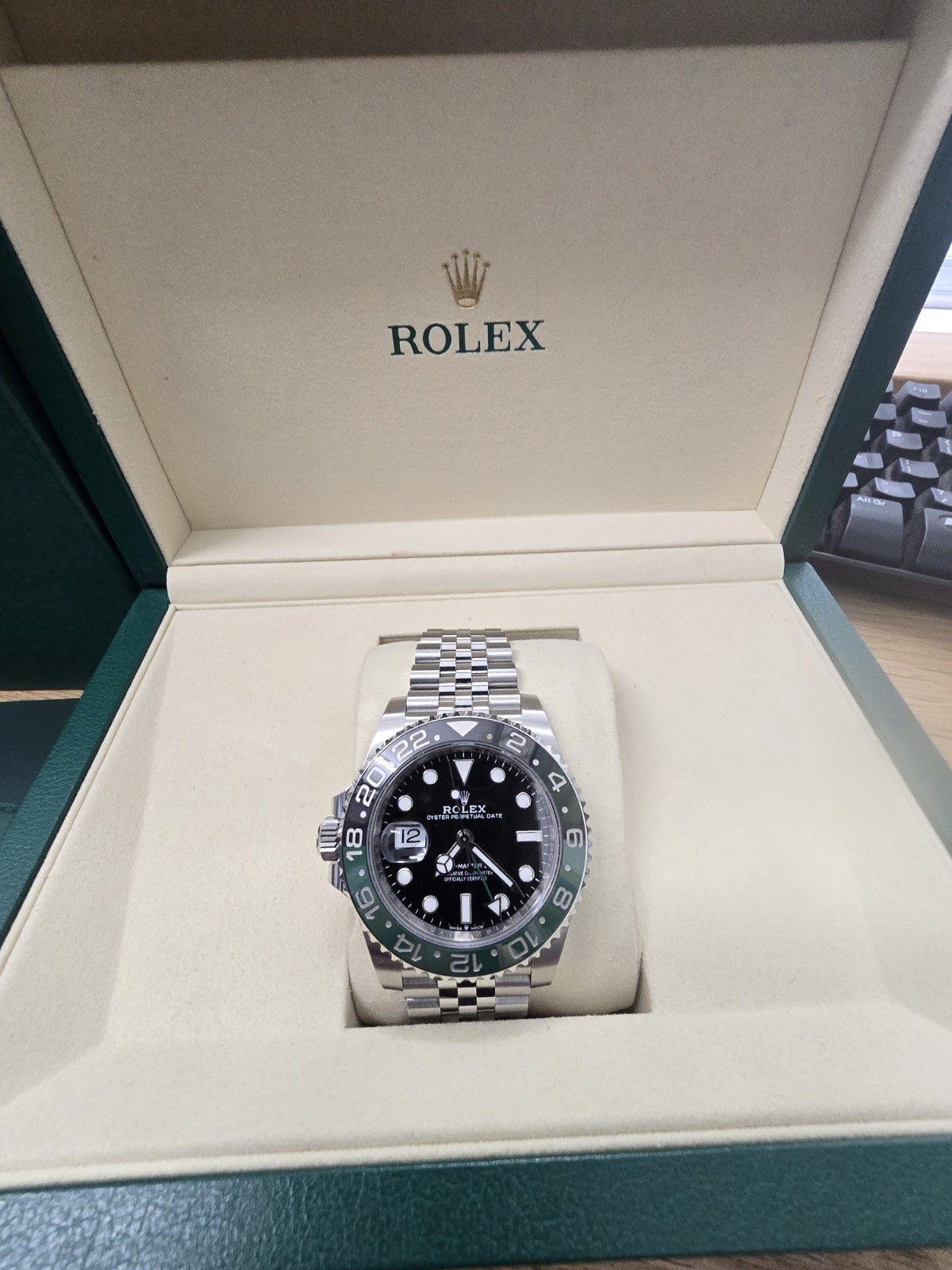 Rolex GMT Master II 126720VTNR watch with green and black bezel, full set, showing the dial and bracelet details.
