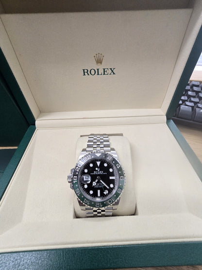 Rolex GMT Master II 126720VTNR watch with green and black bezel, full set, showing the dial and bracelet details.